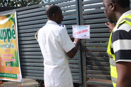 A Kwara government official sealing a facility over noice pollution